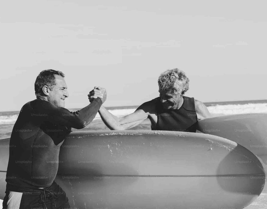 Two men in a group surf lesson in Santa Teresa
